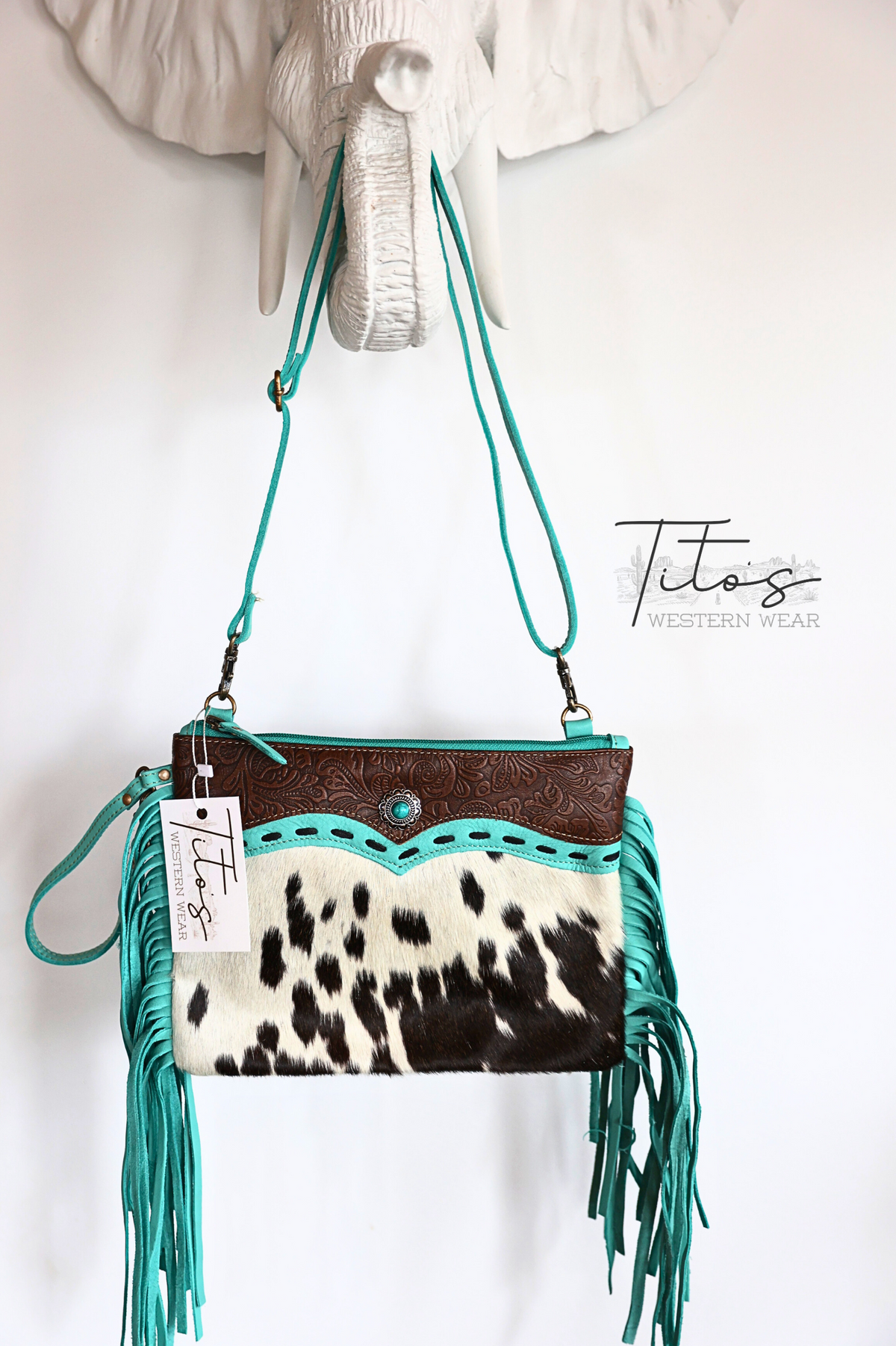 TURQUOISE FRINGE HAIR ON COW PRINT PURSE