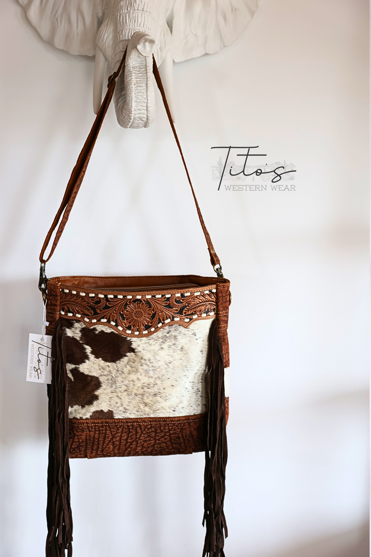 HAIR-ON BUCKET PURSE WITH FRINGE HAND TOOLED